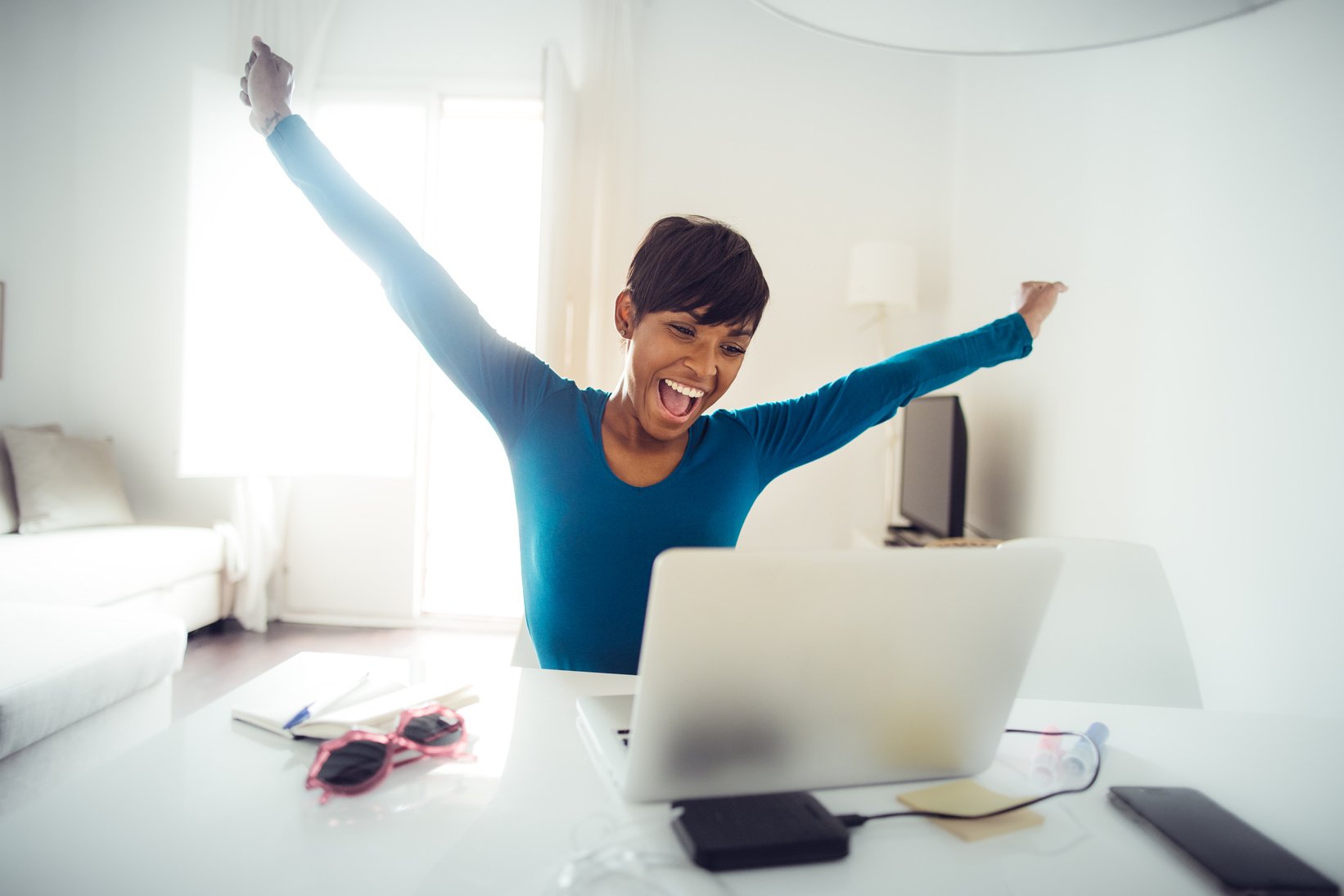 Successful black woman working at home: target reached