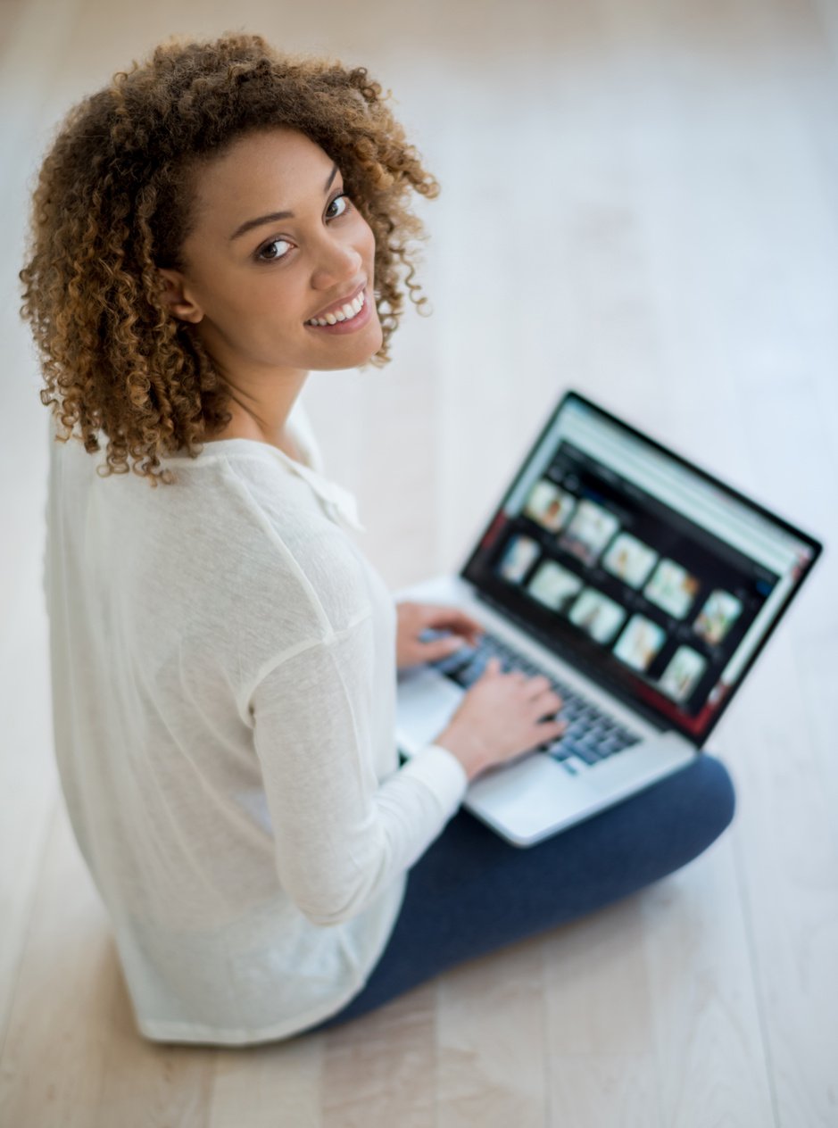 Black woman working online at home