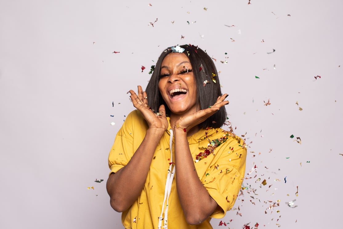 Pretty African Lady Feeling Excited and Happy, with Confetti